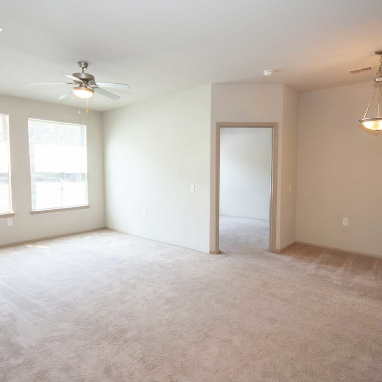 Living room and bedroom entrance at Candler Forrest Apartments - Apartments in Decatur, GA