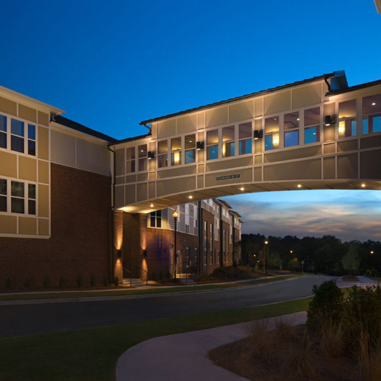 Pathway between apartment buildings at Columbia Brookside Senior Residences - Senior Apartments in Athens, GA