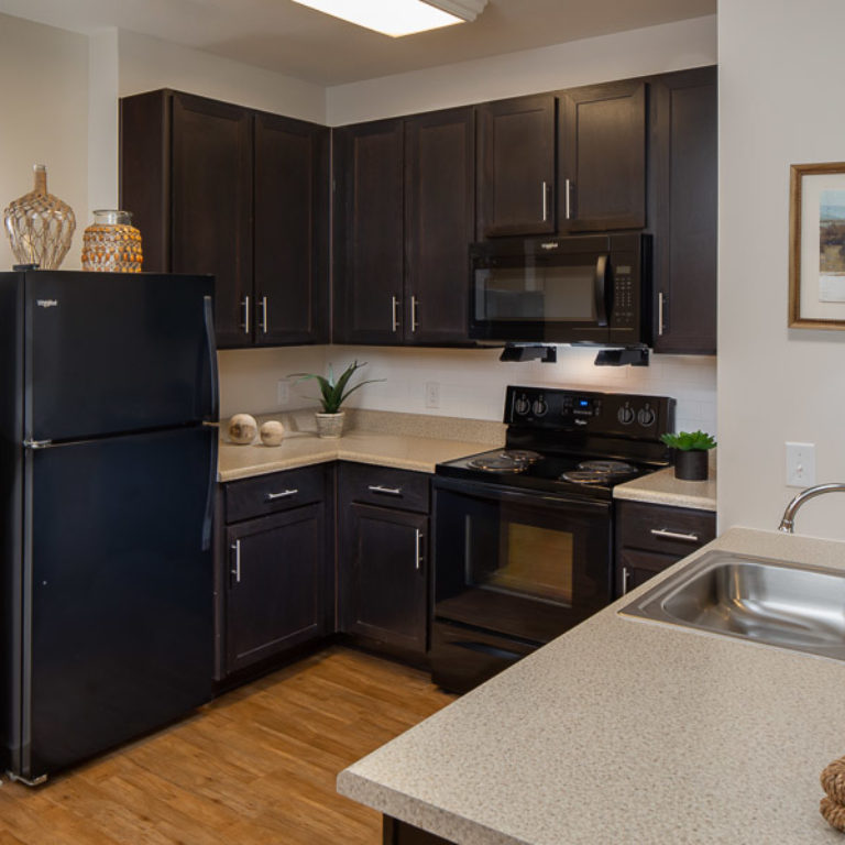 Apartment kitchen at Columbia Senior Residences Community at Decatur East - Senior Apartments in Decatur, GA