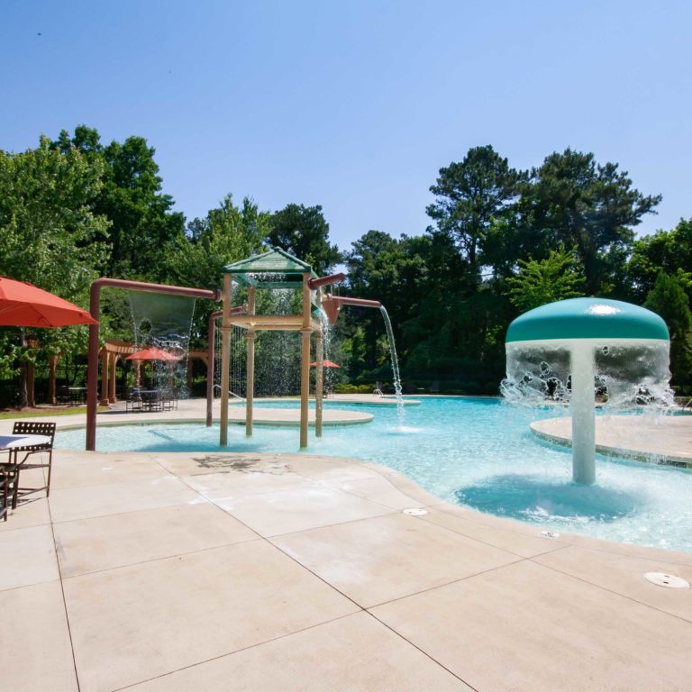 Children's splash zone and sitting area at Park Commons Apartments Community - Senior Apartments in Atlanta, GA