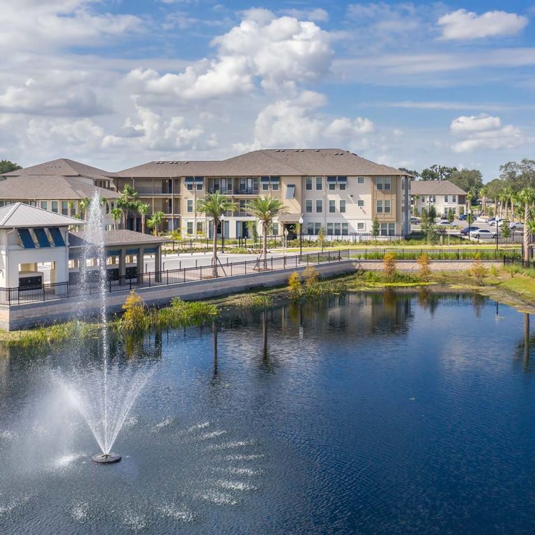 Aerial view of community and lake at Pendana West Lakes - Orlando, FL