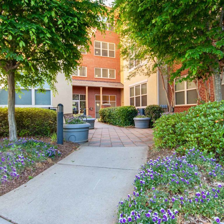 Gardens and pathways at Columbia Blackshear Senior Residences - Senior Apartments in Atlanta, GA