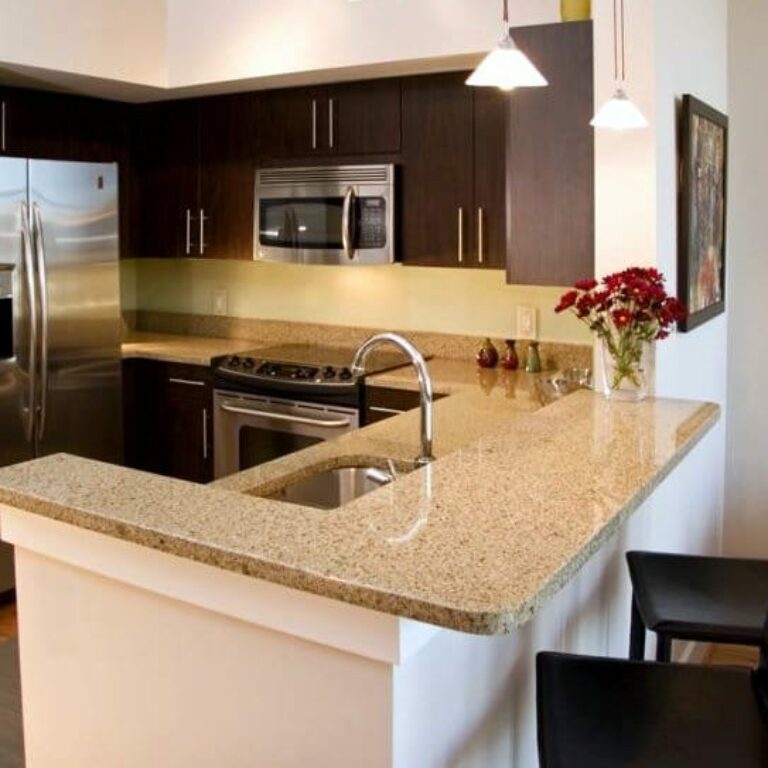 Kitchen with Granite Countertops and stainless steel appliances at Artist Square Atlanta Georgia