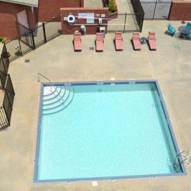 community pool in a courtyard at intown apartments and lofts in atlanta georgia
