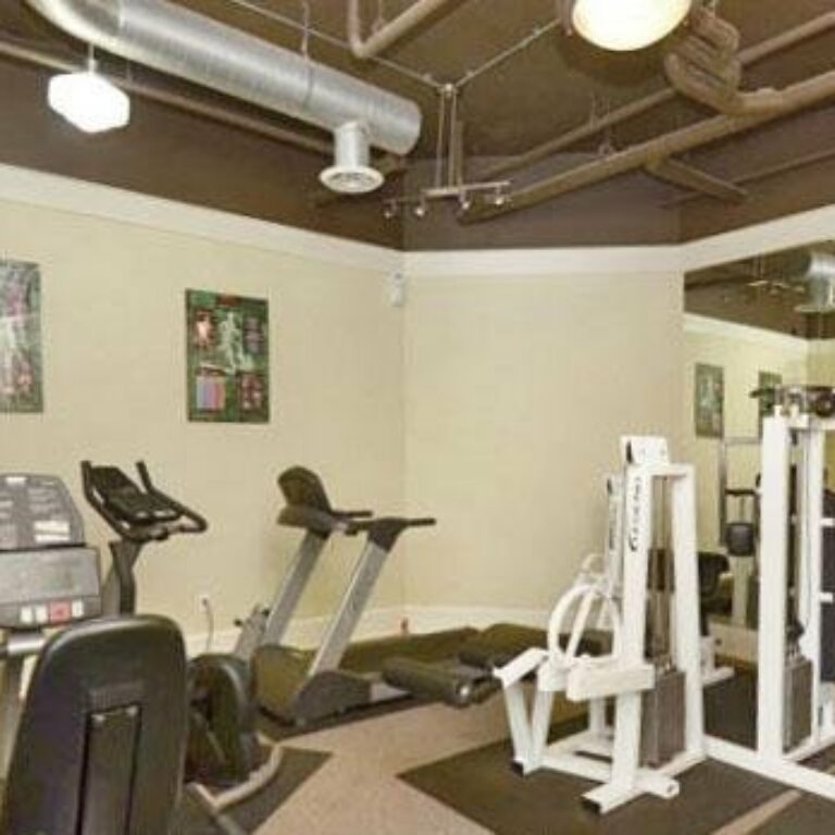 gym equipment and workout room at intown apartments and lofts