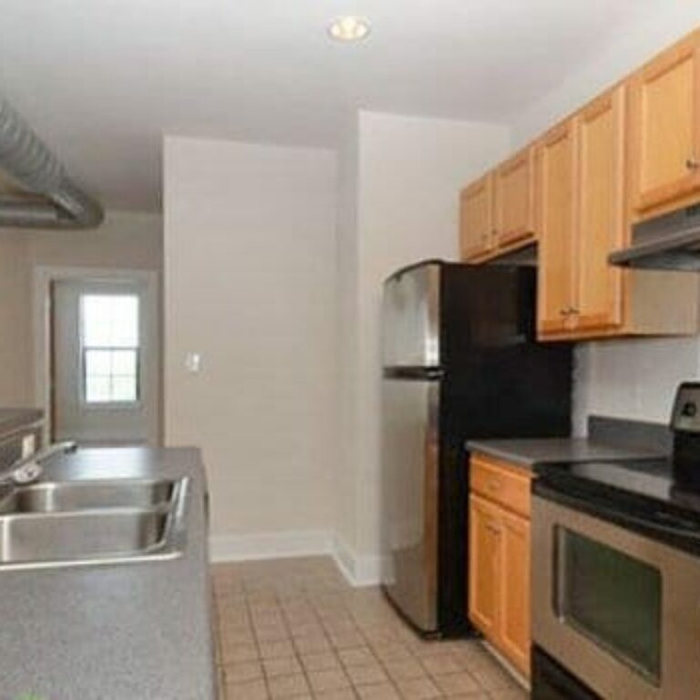 open concept kitchen at bar inside apartment at intown apartments and lofts in atlanta georgia