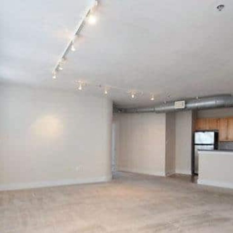 kitchen overlooking living room at intown apartments and lofts