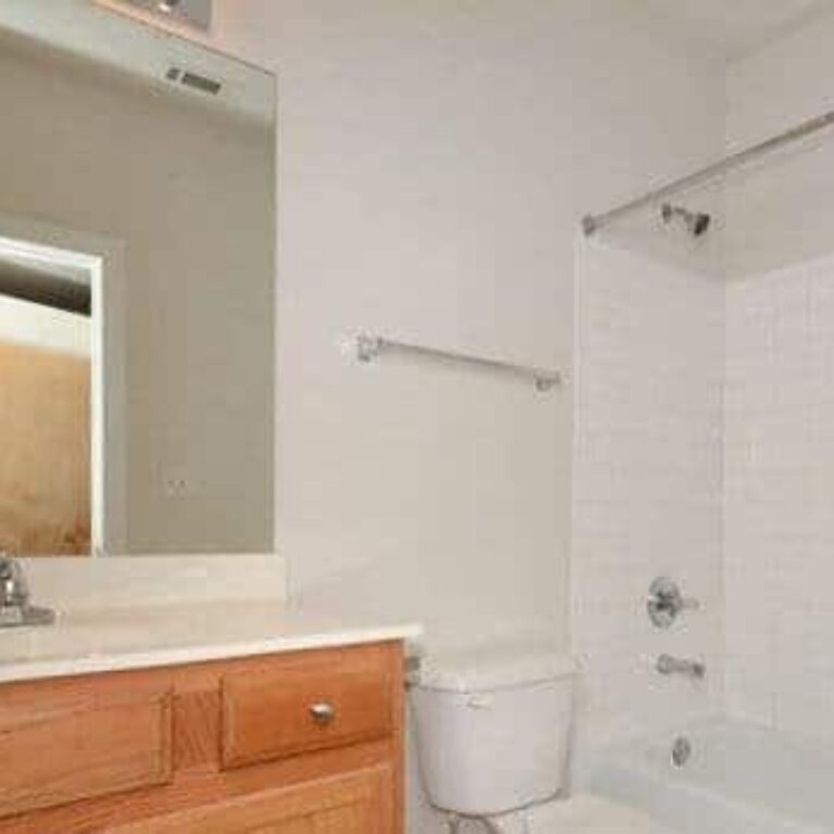 bathroom with tub and shower at intown apartments and lofts