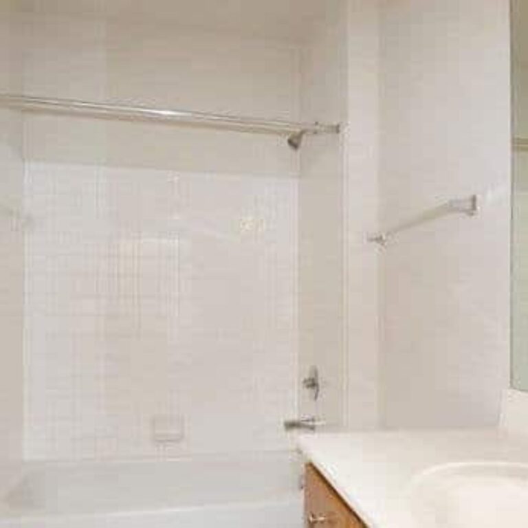 white bathroom sink tub and shower at intown apartments
