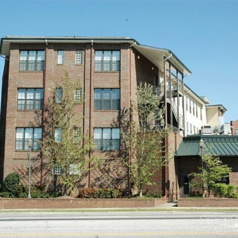 exterior of brick building with trees legacy lofts atlanta georgia