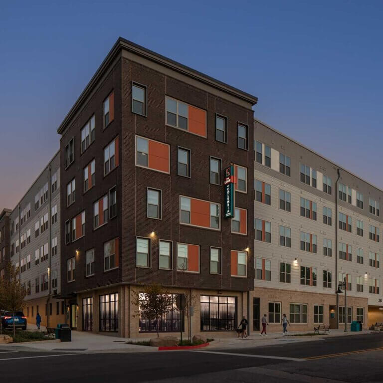 twilight view of the exterior of The Link at Columbia Senior Residences in Decatur Georgia