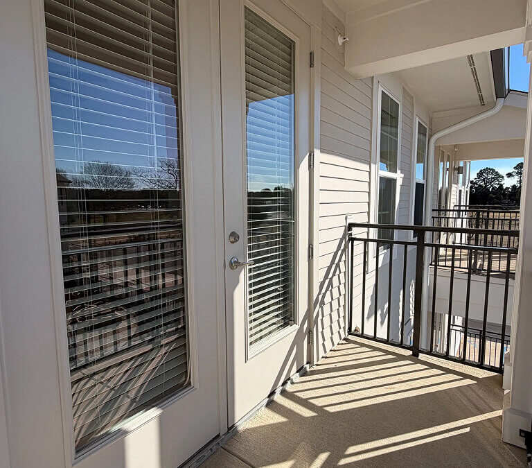 Private apartment balcony with outdoor view and railing