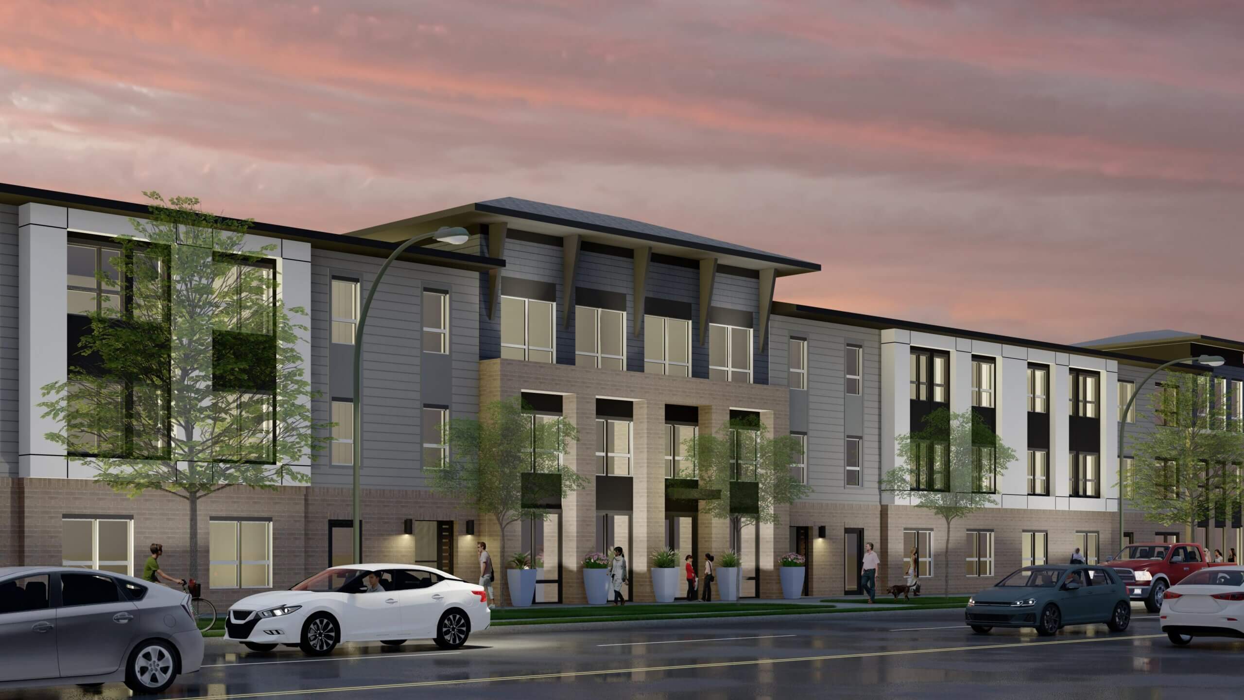Architectural rendering of a modern multi-story residential building, Independence Heights, with gray and white exterior finishes, large windows, and a landscaped entrance. Cars and pedestrians are shown along the street at dusk under a pink sunset sky.