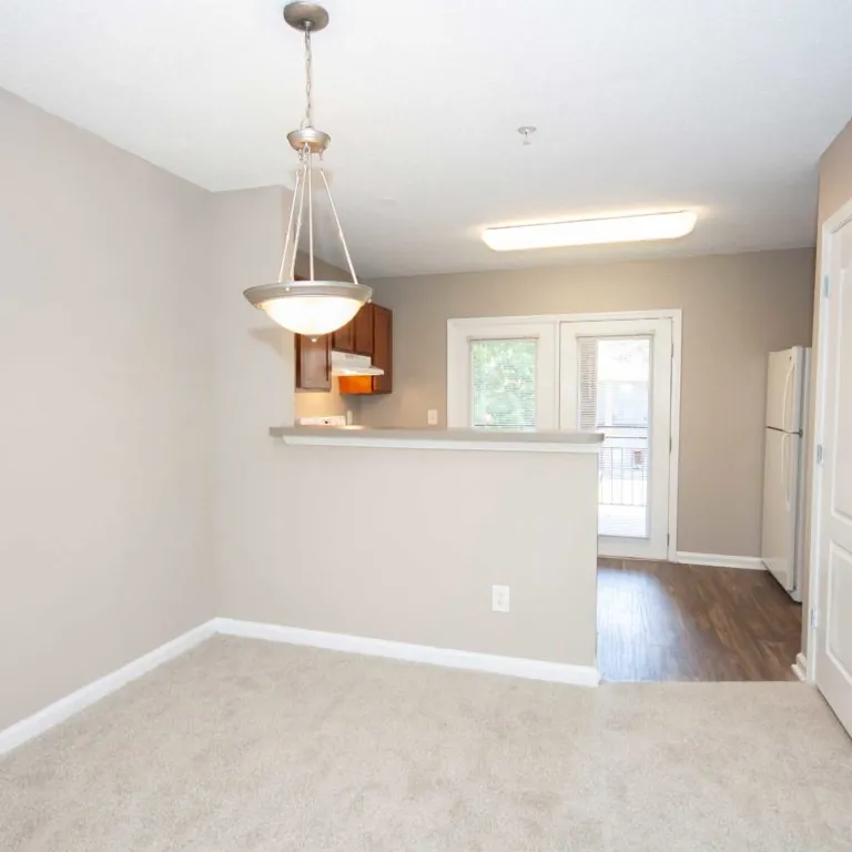 Dinning room and kitchen at Park Commons Apartments Community - Senior Apartments in Atlanta, GA