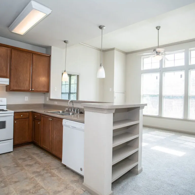 Kitchen and living area view at Columbia Sylvan Hills - Apartments in Atlanta, GA