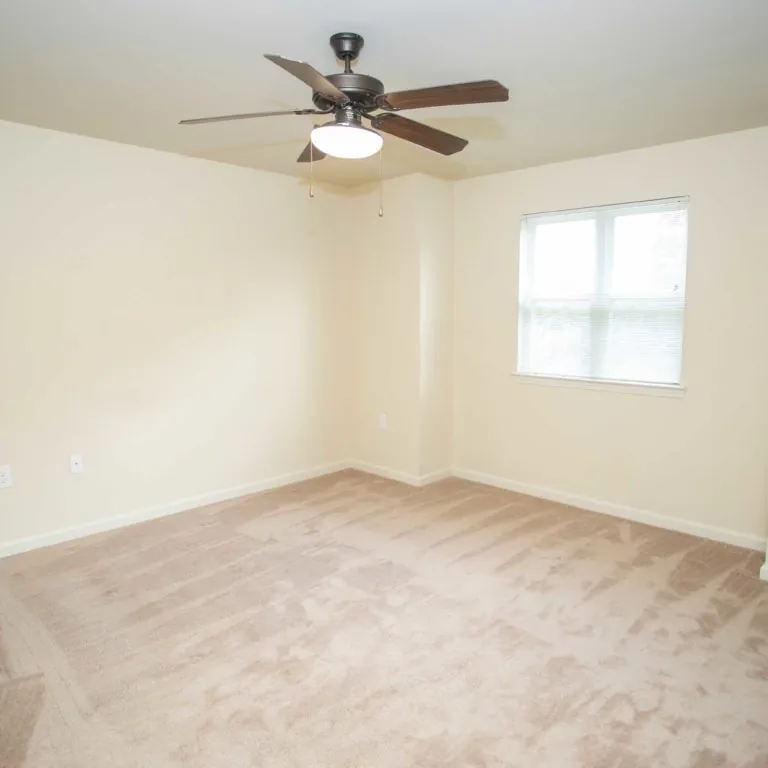 Apartment bedroom at The Retreat at Edgewood Townhomes - Apartments in Atlanta, GA