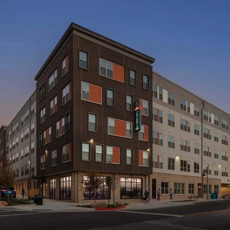 twilight view of the exterior of The Link at Columbia Senior Residences in Decatur Georgia