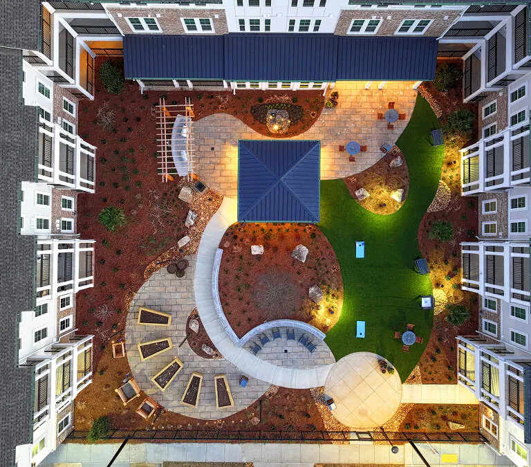 Aerial view of courtyard and outdoor seating at Miles Crossing Senior Residences in Columbus, GA