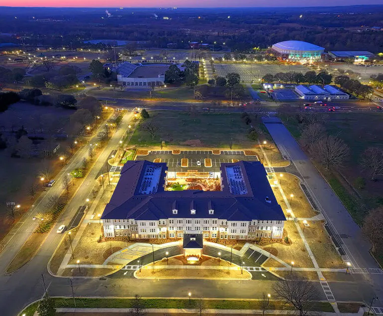 Aerial view of Miles Crossing Senior Residences and surrounding area at night in Columbus, GA